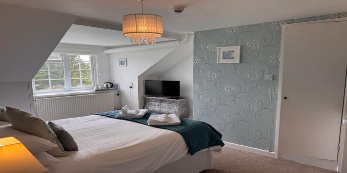 Our luxury en-suite bedrooms offer a tranquil escape after a day exploring Cornwall’s coast. Thoughtfully designed with layered comfort and timeless character, each room blends countryside charm with boutique quality—making your stay feel effortlessly special.
